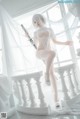 A woman in a white lingerie holding a sword.